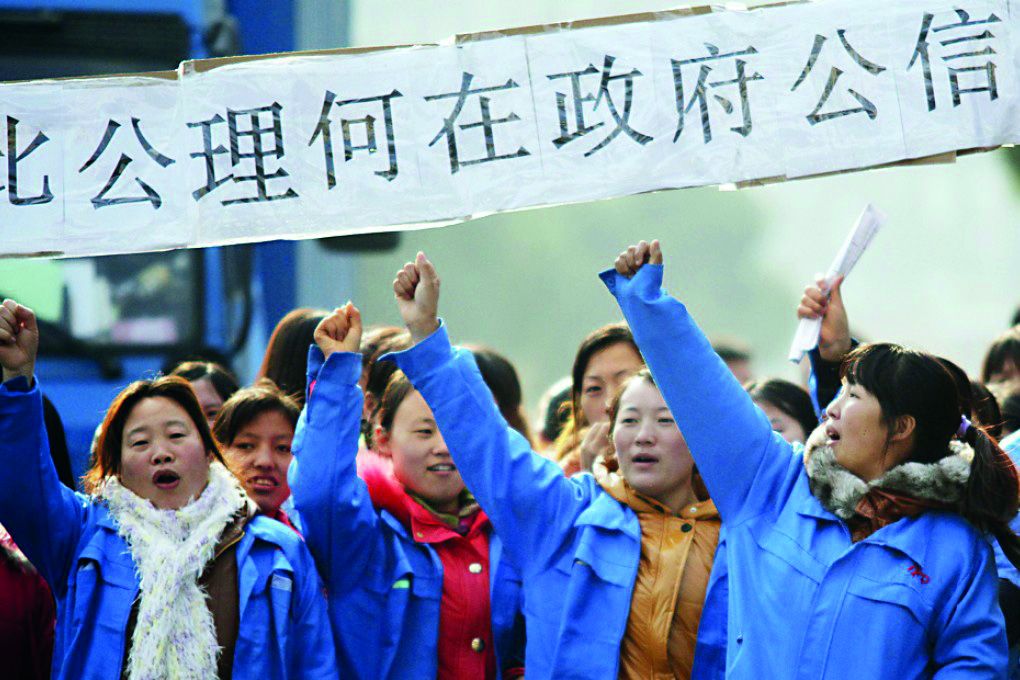 Les travailleuses en grève dans une multinationale spécialisée dans l'électronique à Shanghai. Zach Caddy / Reuters